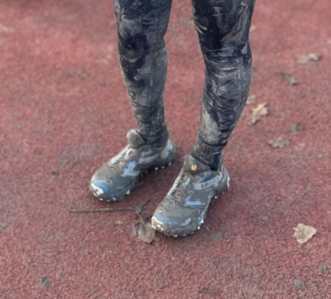 Muddy shoes after an obstacle run